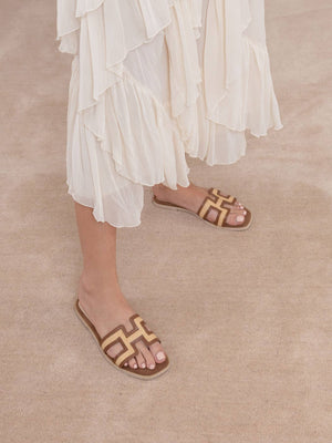 The Ena Brown H Cutout Raffia Slide Sandal