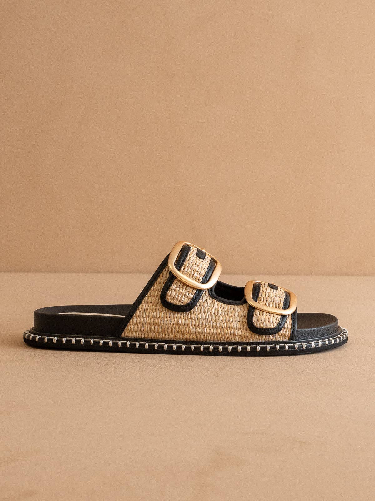 The Daytona Black Two-Tone Raffia Gold Buckle Sandal